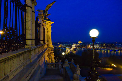 Illuminated city and danube river against sky seen from buda castle