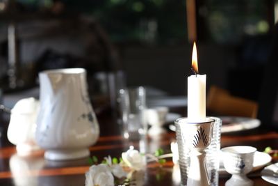 Close-up of candles on table