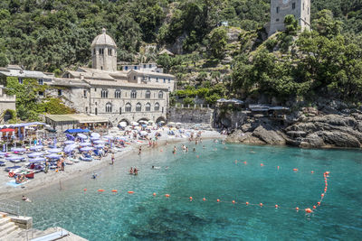  the beautiful bay of san fruttuoso with green water and an abbey near the beach