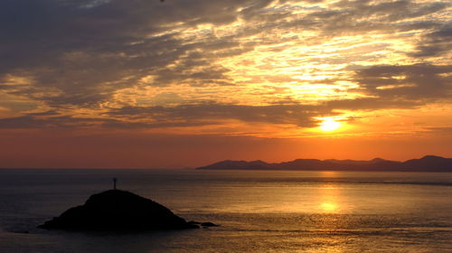 Scenic view of sea against sky during sunset