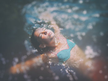 Portrait of woman swimming in water