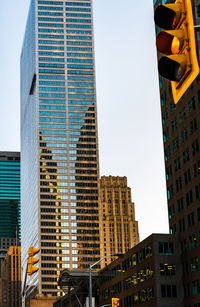 Low angle view of skyscrapers against sky