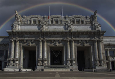 A rainbow above milano centrale, the central railway station in milan, italy