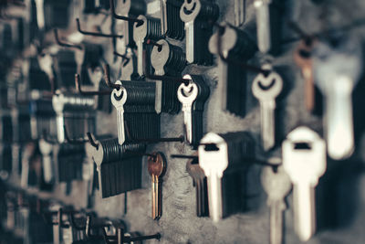 Close-up of keys hanging from nails at store