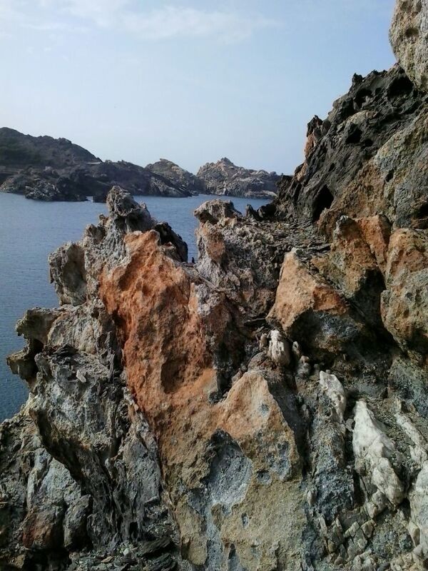 tranquility, tranquil scene, water, rock formation, scenics, sea, beauty in nature, rock - object, nature, sky, rock, mountain, rough, idyllic, cliff, day, rocky, remote, outdoors, no people