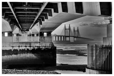 Bridge over sea against sky