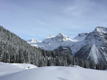 Snow covered mountains against sky