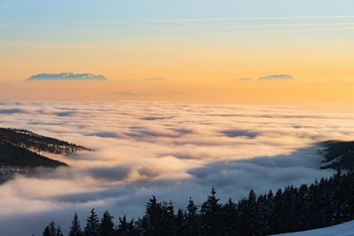 Scenic view of mountains against sky during sunset