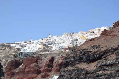 Low angle view of buildings against blue sky