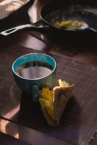 Breakfast in the morning, cold, hot tea, steam, scrambled eggs, dark photography food