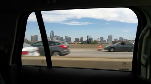 Cars on road seen through car window