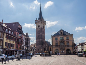 Buildings in city against sky