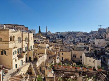 Cityscape against clear blue sky