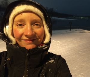 Portrait of smiling man in snow