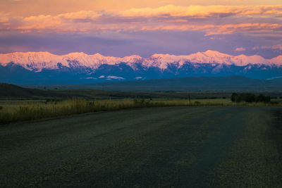 Scenic view of landscape against sky during sunset