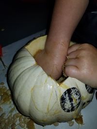 Close-up of hand holding ice cream