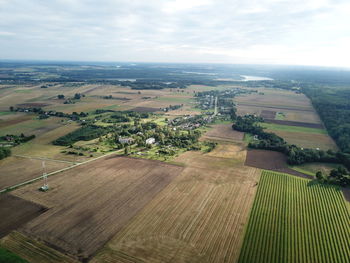 Aerial view of agricultural field against sky