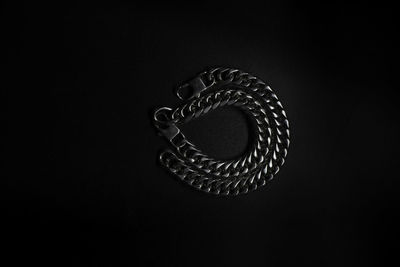 High angle view of spiral object against black background