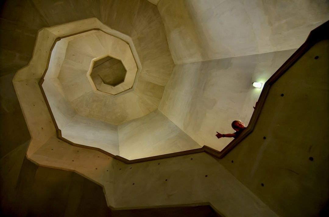 indoors, ceiling, built structure, architecture, low angle view, interior, abandoned, wall - building feature, illuminated, old, lighting equipment, no people, home interior, arch, circle, directly below, damaged, high angle view, hanging, building