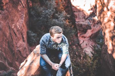 Full length of man standing on rock