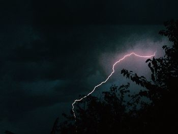 Low angle view of illuminated building at night