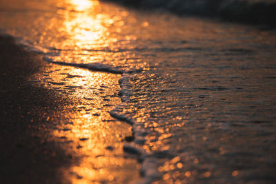 Close-up of sea during sunset