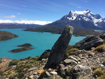 Scenic view of rocks in mountains against blue sky