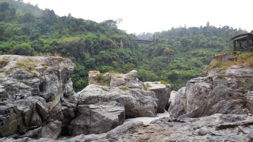 Scenic view of mountain against cloudy sky