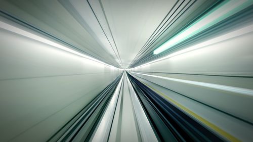 Low angle view of illuminated tunnel