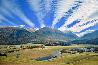 Scenic view of landscape and mountains against sky