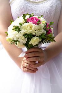 Woman holding flower bouquet