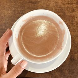 High angle view of coffee cup on table