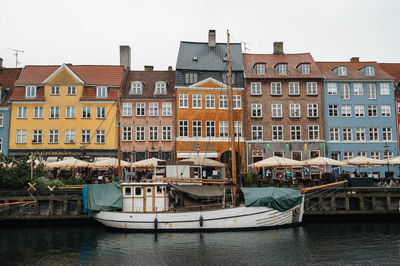 Boats moored at harbor