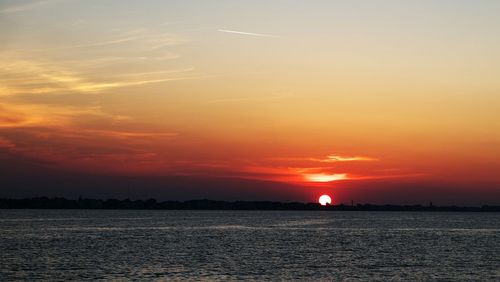 Scenic view of sea at sunset