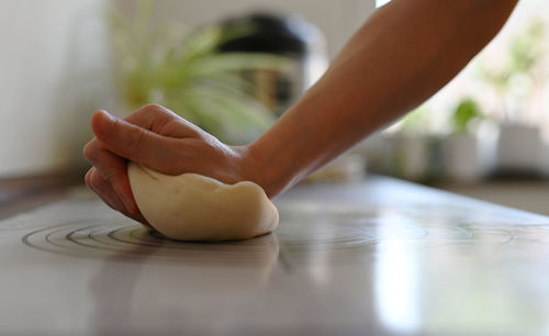 Low section of woman sitting on table