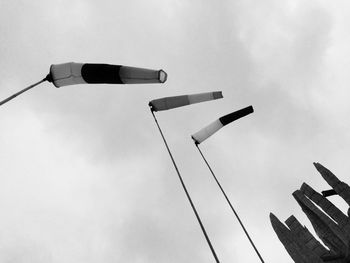 Low angle view of lighting equipment against sky