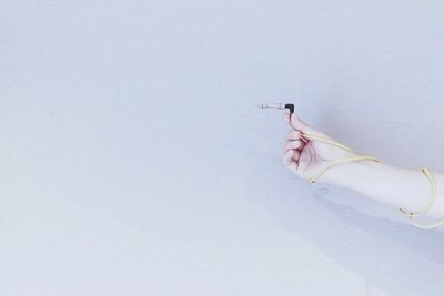 Close-up of woman over white background