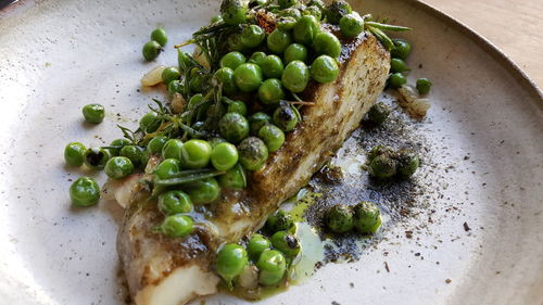 High angle view of vegetables in plate on table