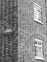 Low angle view of brick wall in building