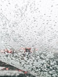 Full frame shot of wet glass window during rainy season