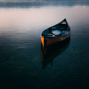 High angle view of boat moored in lake