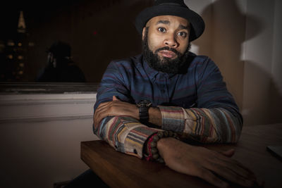 Portrait of young man wearing hat