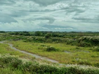 Scenic view of land against sky