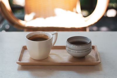 Close-up of coffee cup on table