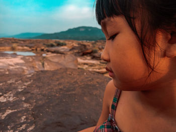 Portrait of girl looking at beach