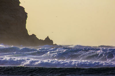 Scenic view of sea against clear sky during sunset