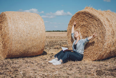 Woman sitting on field