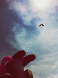 Low angle view of cropped car against sky