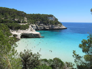 Picturesque view of cala galdana bay against the clear sky on minorca island