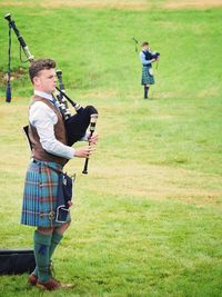 Full length of man playing on field